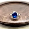 1930040 bague marguerite centrée d'une pierre bleue entourée d'oxydes t54 argent 925 millième (22 ct) 3g argent 925 millième (22 c