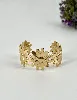 31222864 bracelet manchette motif marguerite en acier doré