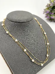 31223145 collier triple chaîne à maille serpent orné de perles synthétiques en acier doré