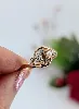bague ancienne en or rose centrée d'un diamant taille brillant et une demie perle et 4 petits diamants taille rose or 750 millième