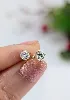 boucles d'oreilles puces en or chacune sertie d'un diamant d'environ 0,30ct or 750 millième (18 ct) 1,18g