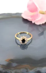 bague marguerite en or centrée d'un saphir entouré de 10 oxydes or 750 millième (18 ct) 2,01g