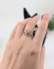 bague fleur en or blanc motif vidé sertie de petits diamants or 375 millième (9 ct) 2,03g