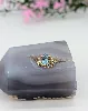 bague ornére d'une aigue-marine épaulée de petits diamants  or 750 millième (18 ct) 4,14g