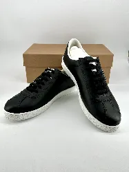 baskets / chaussures tennis chanel en cuir noir avec logo modèle uniform t46