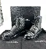 bottes chanel à lacet logo cc en cuir noir mat et verni