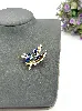 broche en forme d’oiseau colibri ornée d’oxydes en métal doré et en émail