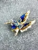 broche en forme d’oiseau colibri ornée d’oxydes en métal doré et en émail