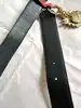 ceinture vintage yves saint laurent en cuir suédé rouge avec pendentif soleil et coeur, boucle martelée dorée taille 85/34