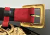 ceinture vintage yves saint laurent en cuir suédé rouge avec pendentif soleil et coeur, boucle martelée dorée taille 85/34