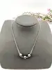 collier en argent ornée de trois perles noir argent 925 millième (22 ct) 5,69g