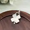 pendentif tiffany & co en forme de trèfle  argent 925 millième (22 ct) 6,12g