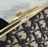 porte-monnaie/pochette vintage christian dior en toile jacquard beige et cuir bleu marine