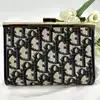 porte-monnaie/pochette vintage christian dior en toile jacquard beige et cuir bleu marine
