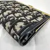 porte-monnaie/pochette vintage christian dior en toile jacquard beige et cuir bleu marine