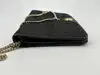 sac dior vintage en toile noir à motif nid d'abeille