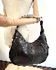 sac yves saint laurent mombasa en cuir noir avec anse corneen bois sous forme de corne
