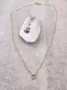 97393445 collier plaqué or 4 pierres verte bleue et roses l 45 cm