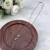 97427445 collier avec pendentif serpent avec perle synthétique l45 cm