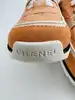 baskets chanel en tisssu et cuir de veau velours orange clair
