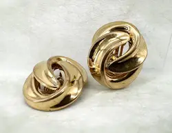 boucles d'oreilles clips dior vintage noeud tourbillon en métal doré