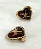 boucles d'oreilles clips vintage christian lacroix coeur et étoile en métal doré et résine ambre
