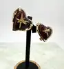 boucles d'oreilles clips vintage christian lacroix coeur et étoile en métal doré et résine ambre