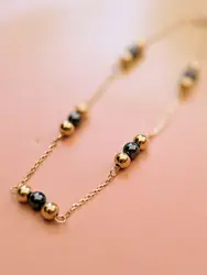 bracelet maille forçat orné des billes d'or et d'hématite or 750 millième (18 ct) 1,91g