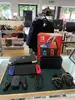 console nintendo switch (modèle oled) avec manettes joy - con bleu néon/rouge néon