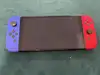 console nintendo switch (modèle oled) avec manettes joy - con bleu néon/rouge néon