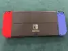 console nintendo switch (modèle oled) avec manettes joy - con bleu néon/rouge néon