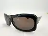 lunettes de soleil chanel 5127-b camélia strass monture noire et verres marron