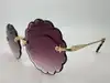 lunettes de soleil chloé rosie ce142s monture dorée et verres violet dégradé