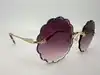 lunettes de soleil chloé rosie ce142s monture dorée et verres violet dégradé