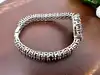 montre bracelet vintage en argent et grenats naturels, cadran nacre, mouvement quartz  argent 925 millième (22 ct) 44,91g