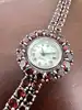 montre bracelet vintage en argent et grenats naturels, cadran nacre, mouvement quartz  argent 925 millième (22 ct) 44,91g