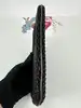 pochette lancel noir effet paille