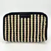 pochette marc by marc jacobs en toile rayé noir et beige