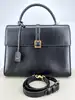 sac à main saint laurent le fermoir top handle en cuir lisse noir avec bandoulière ajustable et amovible