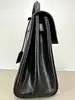 sac à main saint laurent le fermoir top handle en cuir lisse noir avec bandoulière ajustable et amovible