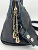sac lancel charmeuse en cuir bleu marine