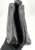 sac porté épaule paco rabanne en cuir lisse noir avec anse à disques métalliques