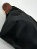 trousse cosmétique avec poignée longchamp le pliage original en toile noire