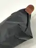 trousse cosmétique avec poignée longchamp le pliage original en toile noire