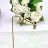 boucles d'oreilles créoles ornées d'oxydes en acier doré