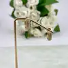 boucles d'oreilles créoles ornées d'oxydes en acier doré