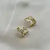 boucles d'oreilles demi-créoles ornées d'oxydes en acier doré
