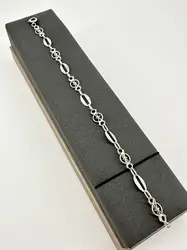 bracelet des maillons ovales lisses et des motifs ajourés en filigrane argent autre 4,99g