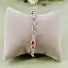 bracelet en argent orné de perles roses logées dans des maillons ajourés argent autre 6,63g