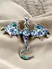 broche dragon en émail bleu et métal doré